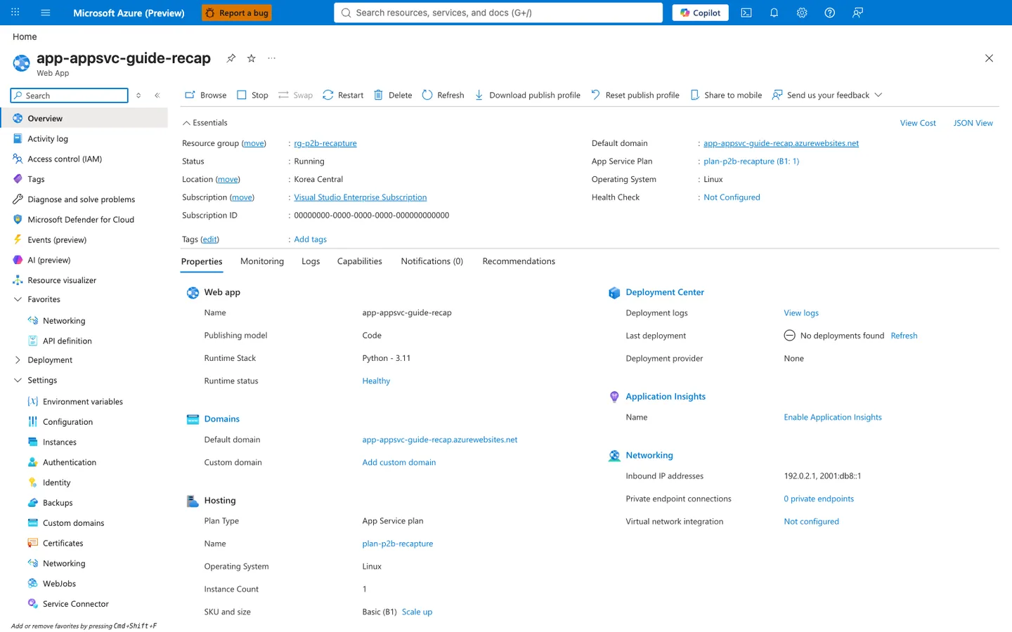 Azure portal Overview blade for `app-appsvc-guide-recap` (Web App) with a command bar (`Browse`, `Stop`, `Swap`, `Restart`, `Delete`, `Refresh`, `Download publish profile`, `Reset publish profile`, `Share to mobile`, `Send us your feedback`) and an Essentials panel showing Resource group `rg-p2b-recapture`, Status `Running`, Location `Korea Central`, Subscription `Visual Studio Enterprise Subscription`, Subscription ID `00000000-0000-0000-0000-000000000000`, Default domain `app-appsvc-guide-recap.azurewebsites.net`, App Service Plan `plan-p2b-recapture (B1: 1)`, Operating System `Linux`, and Health Check `Not Configured`. The Properties tab is selected (next to Monitoring, Logs, Capabilities, Notifications (0), Recommendations) and surfaces Web app (`Name: app-appsvc-guide-recap`, `Publishing model: Code`, `Runtime Stack: Python - 3.11`, `Runtime status: Healthy`), Domains (`Default domain: app-appsvc-guide-recap.azurewebsites.net`, `Custom domain: Add custom domain`), Hosting (`Plan Type: App Service plan`, `Name: plan-p2b-recapture`, `Operating System: Linux`, `Instance Count: 1`, `SKU and size: Basic (B1)` with `Scale up` link), Deployment Center (`Last deployment: No deployments found`, `Deployment provider: None`), Application Insights (`Name: Enable Application Insights`), and Networking (`Inbound IP addresses: 192.0.2.1, 2001:db8::1`, `Private endpoint connections: 0 private endpoints`, `Virtual network integration: Not configured`). Left nav under the search box lists Overview (selected), Activity log, Access control (IAM), Tags, Diagnose and solve problems, Microsoft Defender for Cloud, Events (preview), AI (preview), Resource visualizer, a Favorites group (Networking, API definition), and collapsed groups Deployment and Settings.