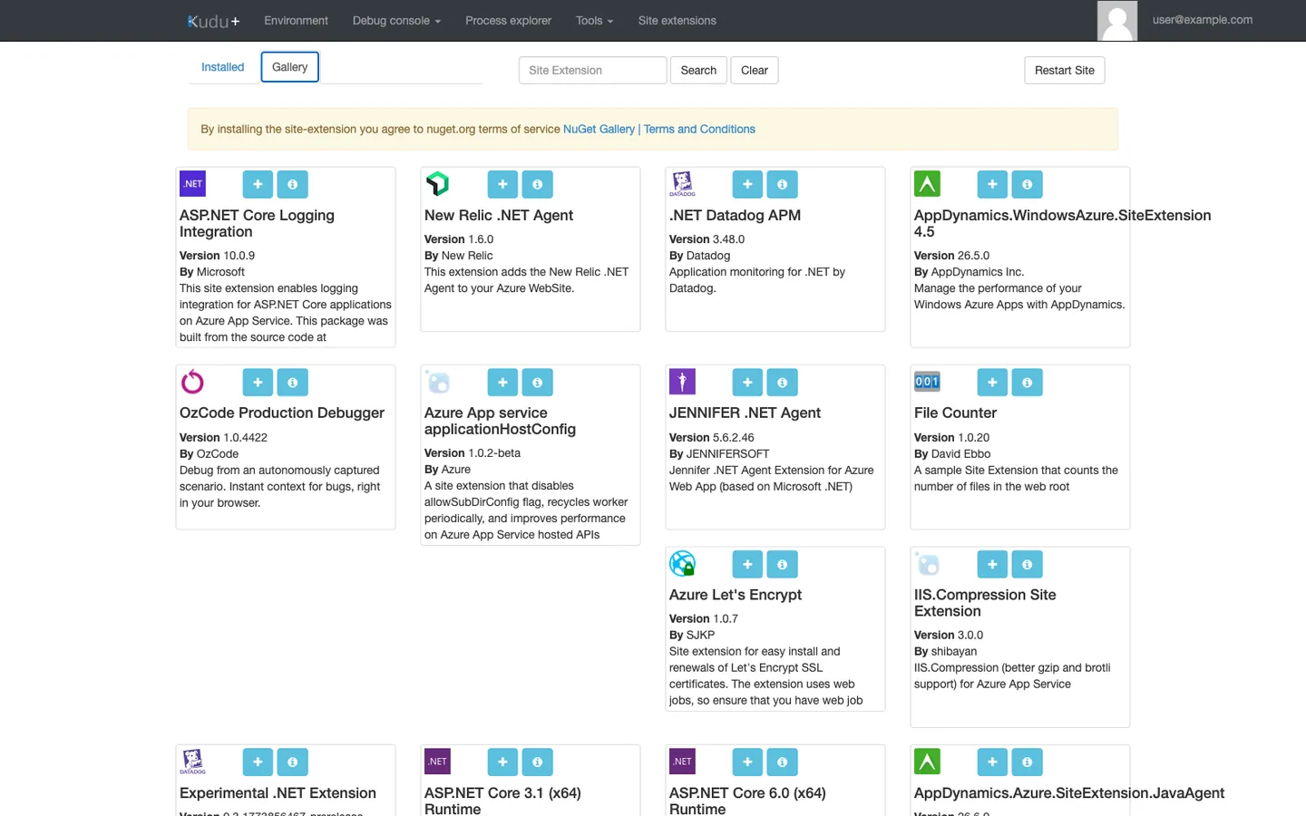 Kudu Site Extensions Gallery on Windows. Top nav shows Environment, Debug console, Process explorer, Tools, Site extensions (current), user@example.com. Two tabs: Installed and Gallery (current/active). The Gallery view displays a grid of extension cards including: ASP.NET Core Logging Integration v10.0.9, New Relic .NET Agent v1.6.0, .NET Datadog APM v3.48.0, AppDynamics 4.5 v26.5.0, OzCode Production Debugger, JENNIFER .NET Agent, File Counter, Azure Let's Encrypt, IIS.Compression. Each card shows the package version, a short description, and a + (Add) button.