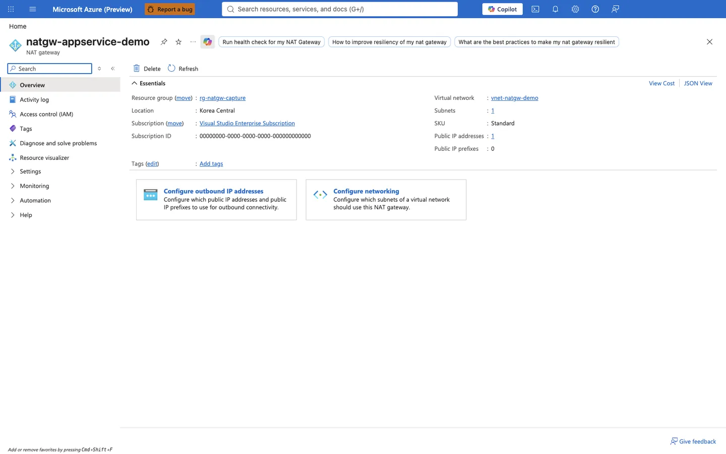 Azure portal Overview blade for a NAT gateway named natgw-appservice-demo. The Essentials panel shows Resource group rg-natgw-capture, Location Korea Central, Subscription Visual Studio Enterprise Subscription, Subscription ID 00000000-0000-0000-0000-000000000000, Virtual network vnet-natgw-demo, Subnets 1, SKU Standard, Public IP addresses 1, and Public IP prefixes 0. Two configuration cards read "Configure outbound IP addresses" and "Configure networking", the latter describing which subnets of a virtual network should use this NAT gateway.