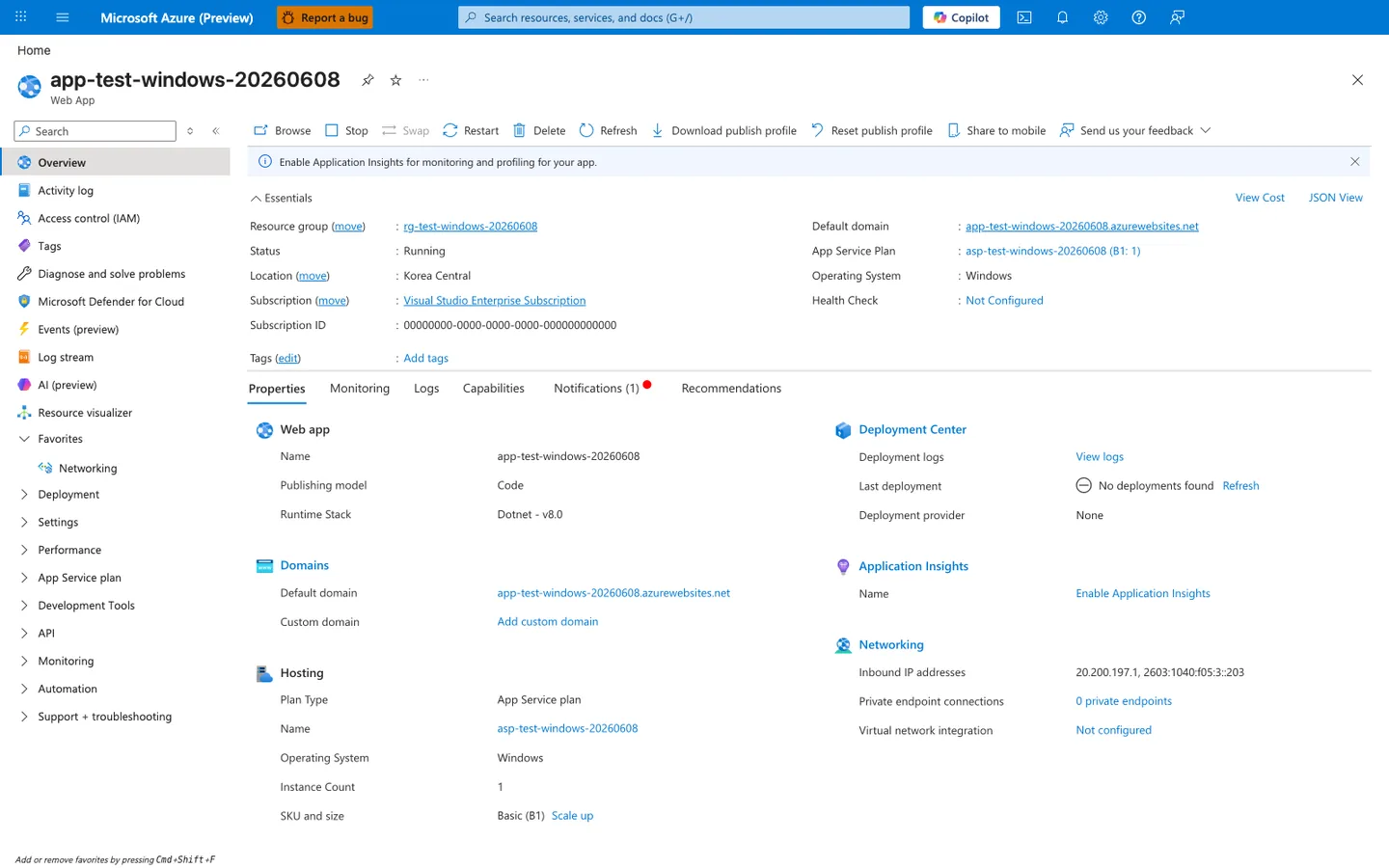 Azure portal Overview blade for the app-test-windows-20260608 Web App. The top command bar shows Browse, Stop, Swap, Restart, Delete, Refresh, Download publish profile, Reset publish profile, Share to mobile, Send us your feedback. The Essentials section lists Resource group rg-test-windows-20260608, Status Running, Location Korea Central, Subscription Visual Studio Enterprise Subscription, Subscription ID 00000000-0000-0000-0000-000000000000 (PII masked), Default domain <azurewebsites-domain-redacted>, App Service Plan asp-test-windows-20260608 (B1: 1), Operating System Windows, Health Check Not Configured. The Properties tab is selected, showing a Web app card with Name app-test-windows-20260608, Publishing model Code, Runtime Stack Dotnet - v8.0, and a Hosting card with Plan Type App Service plan, Name asp-test-windows-20260608, Operating System Windows, Instance Count 1, SKU and size Basic (B1). The left navigation rail lists Overview, Activity log, Access control (IAM), Tags, Diagnose and solve problems, Microsoft Defender for Cloud, Events (preview), Log stream, AI (preview), Resource visualizer, Networking, Deployment, Settings, Performance, App Service plan, Development Tools, API, Monitoring, Automation, Support + troubleshooting.